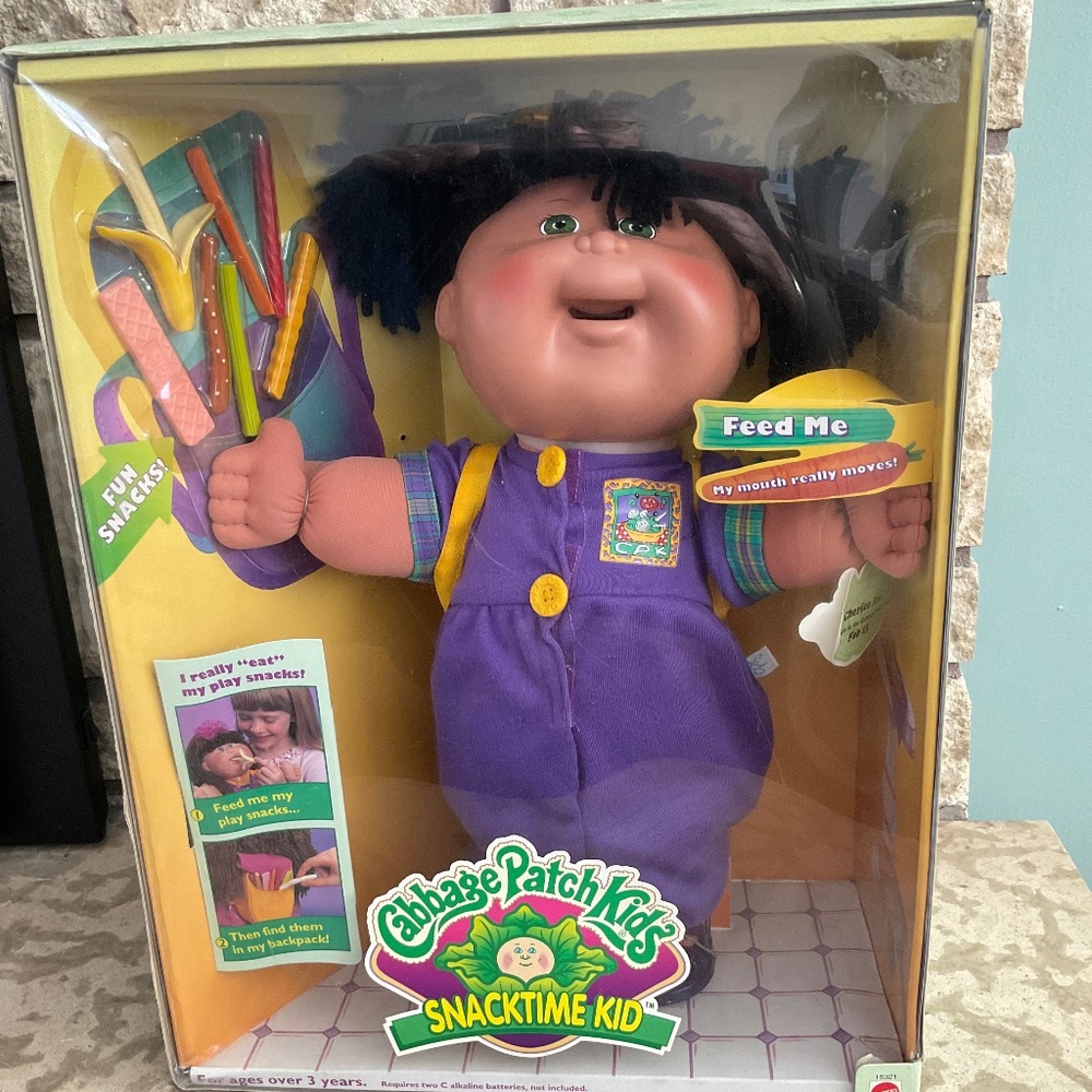 Cabbage Patch Kids Doll with Purple Outfit and Colorful Accessories